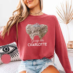 Gossip Like Charlotte Comfort Colors long sleeve shirt featuring a historical fiction and Regency-inspired literary graphic on a relaxed garment-dyed cotton tee in Crimson