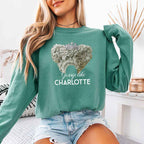 Gossip Like Charlotte Comfort Colors long sleeve shirt featuring a historical fiction and Regency-inspired literary graphic on a relaxed garment-dyed cotton tee in Light Green