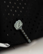 Thor’s Hammer Black perforated rope golf hat by Pins & Aces featuring a hammer-inspired design, adjustable snapback, breathable perforations, and built-in magnetic ball marker holder.