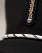 Thor’s Hammer Black perforated rope golf hat by Pins & Aces featuring a hammer-inspired design, adjustable snapback, breathable perforations, and built-in magnetic ball marker holder.