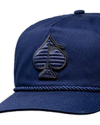 Heritage Navy rope golf hat by Pins & Aces featuring a low-profile 5-panel design, rope accent, adjustable snapback, and built-in magnetic golf ball marker holder.