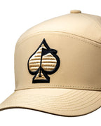 Tradesman Sand golf hat by Pins & Aces featuring a warm neutral sand colorway, adjustable snapback closure, and built-in magnetic golf ball marker holder.