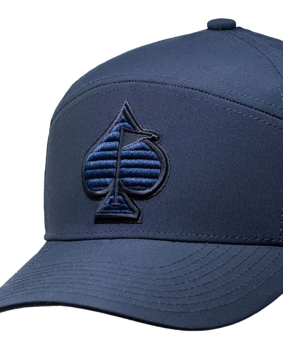 Tradesman Navy golf hat by Pins & Aces featuring a tonal embroidered spade logo, structured 6-panel design, perforated side panels, curved bill, and adjustable snapback.