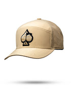 Tradesman Sand golf hat by Pins & Aces featuring a warm neutral sand colorway, adjustable snapback closure, and built-in magnetic golf ball marker holder.