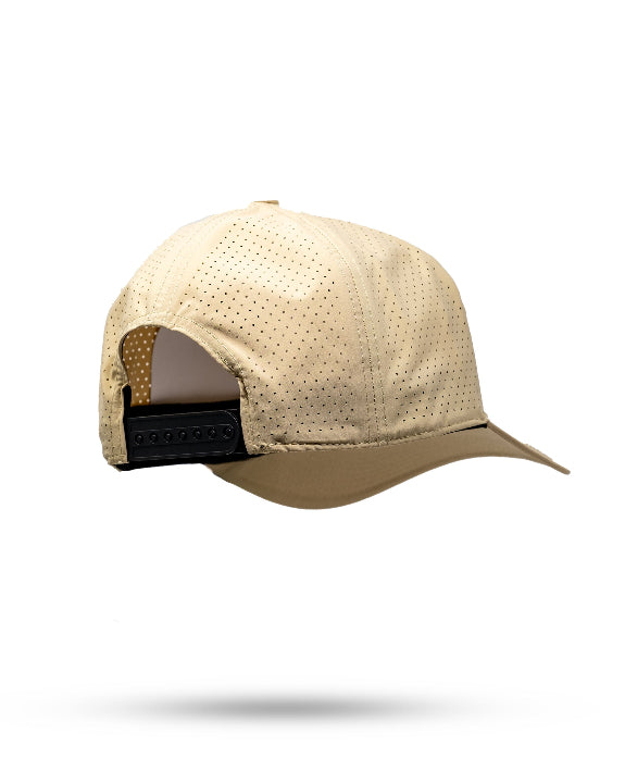 Tradesman Sand golf hat by Pins & Aces featuring a warm neutral sand colorway, adjustable snapback closure, and built-in magnetic golf ball marker holder.