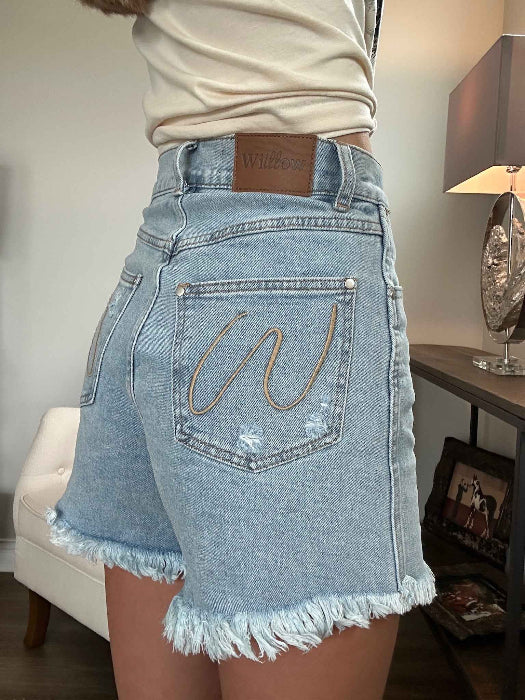 Brooke High Waisted Denim Shorts featuring a flattering high-rise waist, premium stretch denim, subtle distressed details, classic five-pocket styling, and a frayed hem for an effortless boutique summer look. Comes in a Light Wash