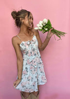 High School Sweetheart Mini Dress featuring a flattering sweetheart neckline, feminine tiered skirt, back zipper closure, and lightweight fabric, perfect for weddings, bridal showers, vacations, and spring or summer occasions. Color is Light Blue