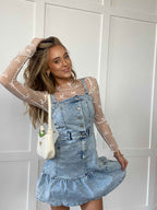 Naomi Square Neck Denim Dress featuring a flattering square neckline, button-front closure, sleeveless silhouette, soft denim fabric, and feminine ruffle hem for a timeless boutique look.