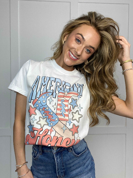 American Honey Graphic Tee printed on premium Comfort Colors 100% cotton featuring an exclusive Willow Boutique western-inspired design, perfect for country concerts, Nashville trips, rodeos, and everyday country style. Tshirt in White
