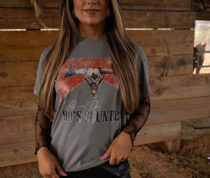 Raised On 90's Country Graphic Tee printed on premium Comfort Colors cotton, featuring an exclusive Willow Boutique design perfect for country concerts, rodeos, and everyday western-inspired style.