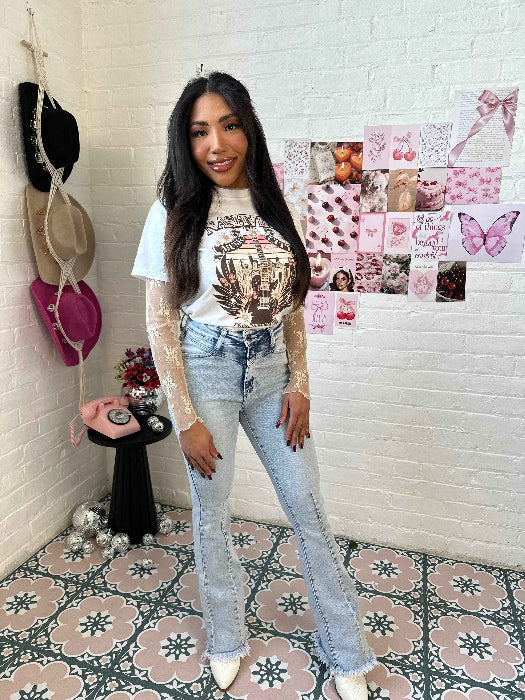 Keep Up Flare Acid Wash Jeans featuring Willow Boutique's exclusive V-Cross waistband, high-rise fit, mega stretch denim, frayed hem, and dramatic flare leg for a flattering boutique look.