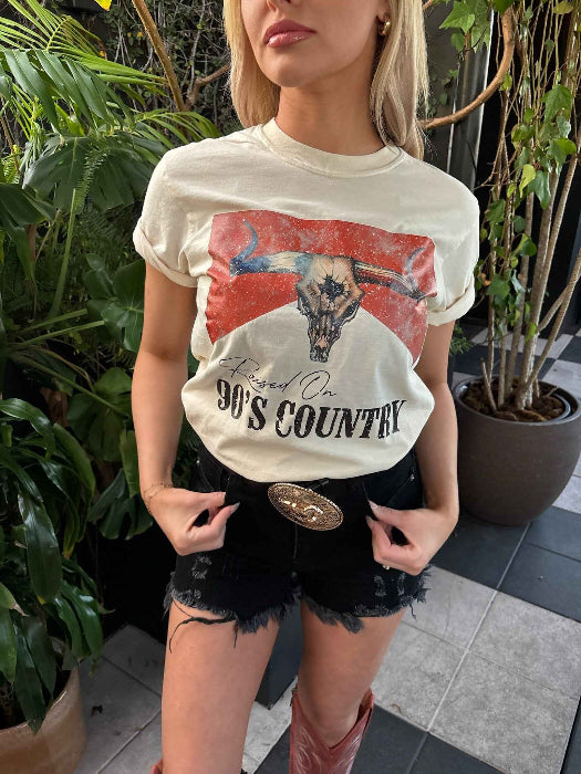 Raised On 90's Country Graphic Tee printed on premium Comfort Colors cotton, featuring an exclusive Willow Boutique design perfect for country concerts, rodeos, and everyday western-inspired style.