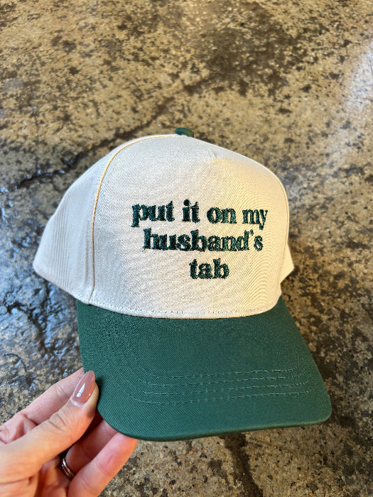 Put it on my husband's tab trucker hat in green/ivory