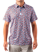 Men’s Bomb Pop Splatter golf polo by Pins & Aces featuring an all-over red, white, and blue splatter pattern with short sleeves and an athletic performance fit.