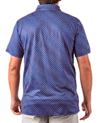 Men’s Wavy Stars & Stripes golf polo by Pins & Aces featuring a navy, red, and white wavy patriotic pattern with short sleeves and an athletic performance fit.