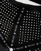 Ace/King Black perforated rope golf hat by Pins & Aces featuring a black poker-inspired design, braided rope accent, adjustable snapback, and built-in magnetic ball marker holder.