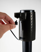 Black LiquorStick® 3.0 golf drink dispenser featuring a 750ml stainless steel reservoir, USB-C rechargeable automatic pump, insulated construction, and ground spike.