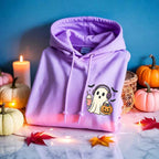 Little Ghost Iced Coffee Halloween hoodie featuring a cute ghost holding an iced coffee on a cozy classic-fit graphic sweatshirt in Violet