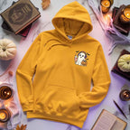 Little Ghost Iced Coffee Halloween hoodie featuring a cute ghost holding an iced coffee on a cozy classic-fit graphic sweatshirt in Gold
