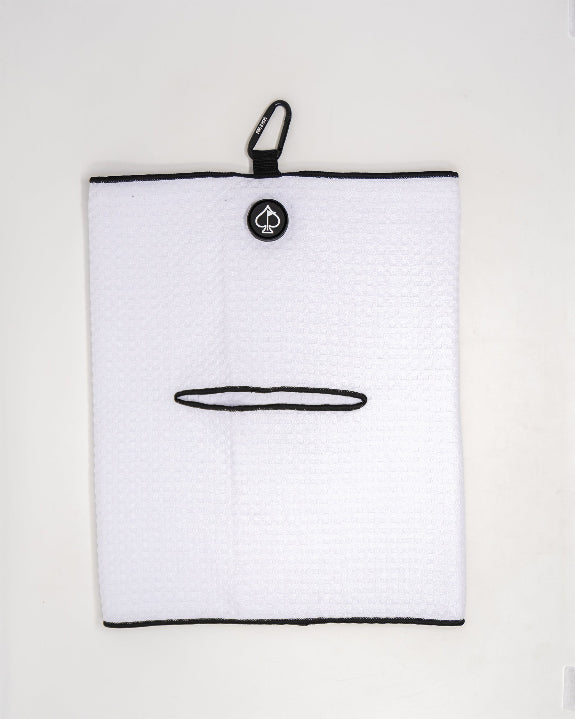 White Pins & Aces magnetic golf towel featuring durable waffle-knit fabric, a strong built-in magnet, center slit, and carabiner for attaching to a golf bag.