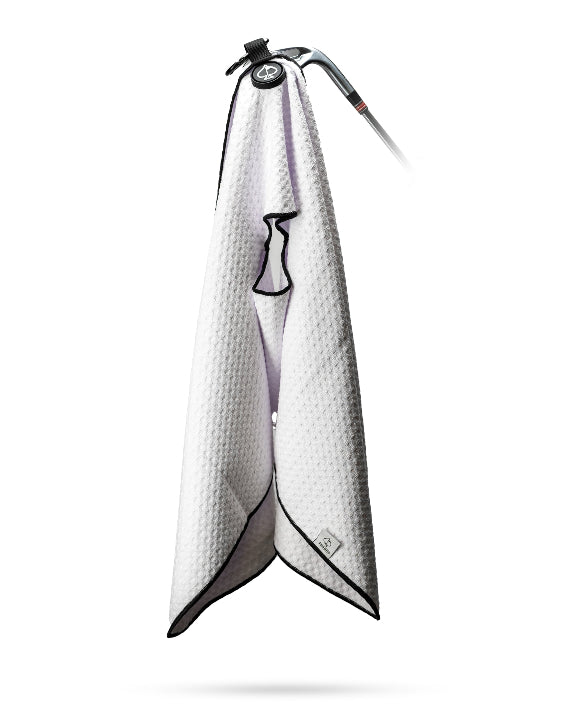 White Pins & Aces magnetic golf towel featuring durable waffle-knit fabric, a strong built-in magnet, center slit, and carabiner for attaching to a golf bag.