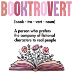 Clear glass cup with bamboo lid and straw featuring pink Booktrovert lettering, a definition about preferring fictional characters to real people, and an open book filled with pink and purple flowers.