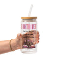 Clear glass cup with bamboo lid and straw featuring pink Booktrovert lettering, a definition about preferring fictional characters to real people, and an open book filled with pink and purple flowers.