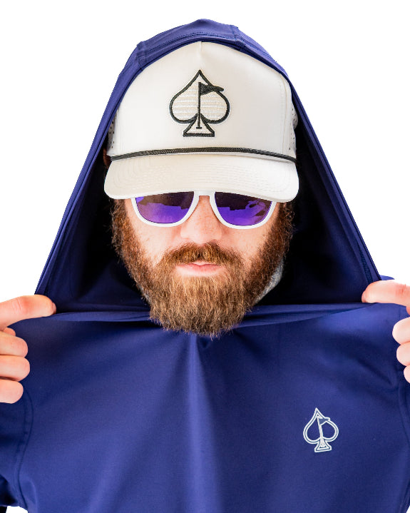 Men’s navy performance golf hoodie by Pins & Aces featuring a lightweight long-sleeve design, lay-flat hood, embroidered spade chest logo, and relaxed athletic fit.