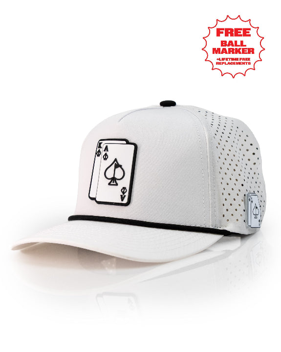 Ace/King White perforated rope golf hat by Pins & Aces with an adjustable snapback, built-in magnetic ball marker holder, and matching golf ball marker.