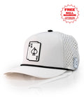 Ace/King White perforated rope golf hat by Pins & Aces with an adjustable snapback, built-in magnetic ball marker holder, and matching golf ball marker.