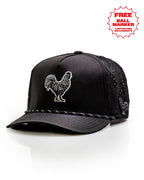 Black Pins & Aces perforated rope golf hat featuring an embroidered rooster on the front, breathable side panels, rope detail, and adjustable snapback design.
