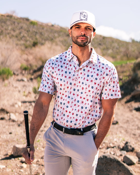 Pins & Aces American Traditional men’s golf polo featuring a bold patriotic Americana and classic tattoo flash-inspired design with an athletic performance fit.