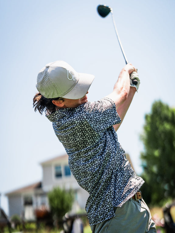 Men’s Shark Tooth golf polo by Pins & Aces featuring an all-over black, charcoal, gray, and white shark tooth-inspired micro print with short sleeves and an athletic performance fit.