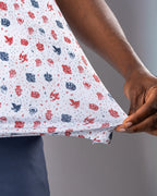 Pins & Aces American Traditional men’s golf polo featuring a bold patriotic Americana and classic tattoo flash-inspired design with an athletic performance fit.