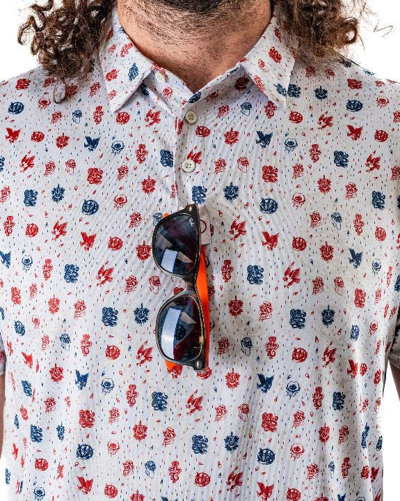 Pins & Aces American Traditional men’s golf polo featuring a bold patriotic Americana and classic tattoo flash-inspired design with an athletic performance fit.