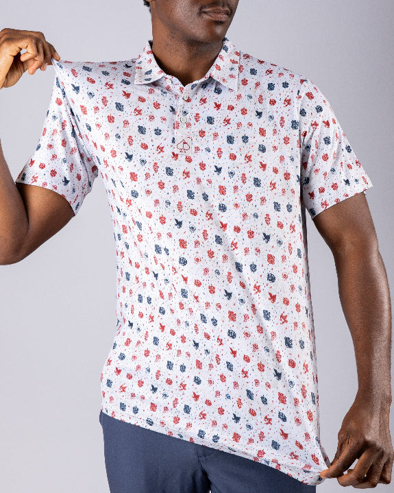 Pins & Aces American Traditional men’s golf polo featuring a bold patriotic Americana and classic tattoo flash-inspired design with an athletic performance fit.