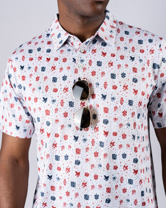 Pins & Aces American Traditional men’s golf polo featuring a bold patriotic Americana and classic tattoo flash-inspired design with an athletic performance fit.