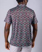 Men’s Cocoa Verde golf polo by Pins & Aces featuring a cocoa brown background with an all-over teal geometric print, short sleeves, and athletic performance fit.