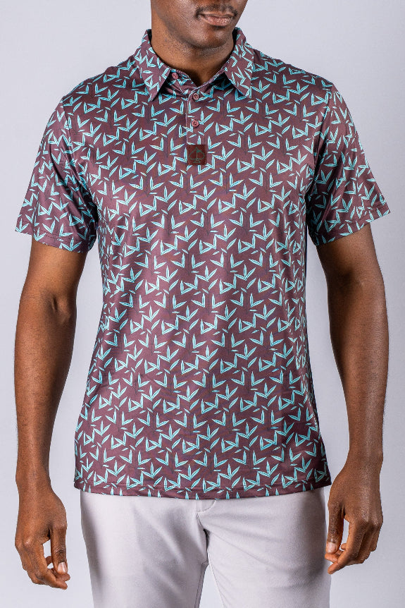Men’s Cocoa Verde golf polo by Pins & Aces featuring a cocoa brown background with an all-over teal geometric print, short sleeves, and athletic performance fit.