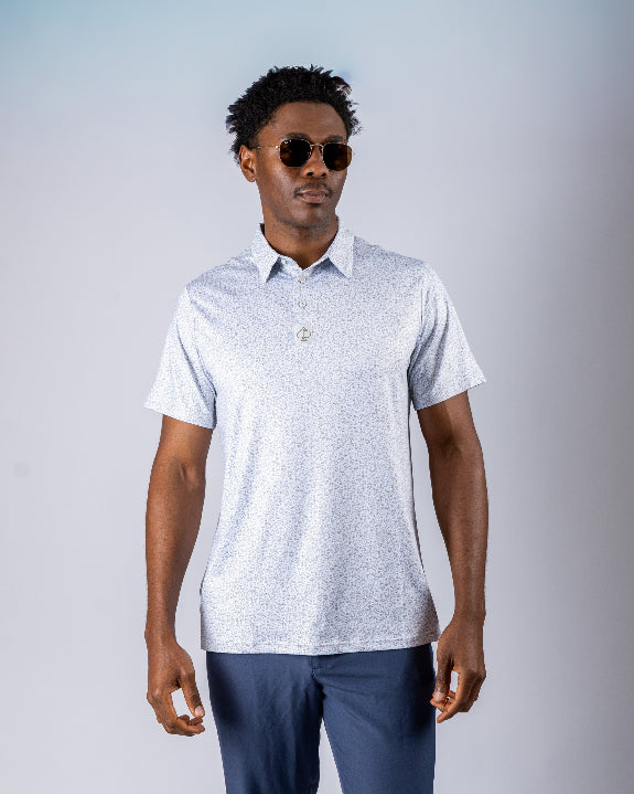 Men’s Man’s Best Friend Light golf polo by Pins & Aces featuring a subtle dog-inspired micro print in light blue and white with short sleeves and an athletic performance fit.