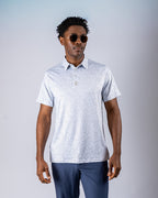 Men’s Man’s Best Friend Light golf polo by Pins & Aces featuring a subtle dog-inspired micro print in light blue and white with short sleeves and an athletic performance fit.