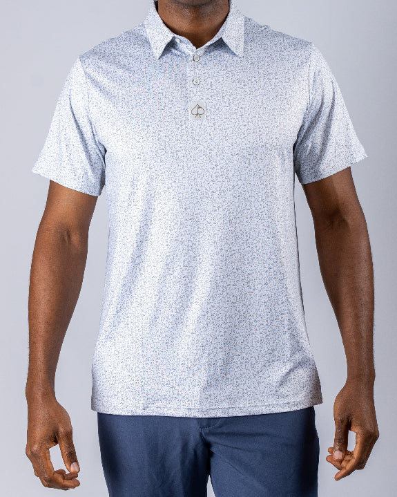 Men’s Man’s Best Friend Light golf polo by Pins & Aces featuring a subtle dog-inspired micro print in light blue and white with short sleeves and an athletic performance fit.