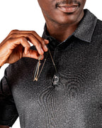 Men’s Man’s Best Friend Dark golf polo by Pins & Aces featuring a subtle dog-inspired pattern on a dark charcoal performance polo with short sleeves and athletic fit.