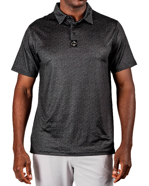 Men’s Man’s Best Friend Dark golf polo by Pins & Aces featuring a subtle dog-inspired pattern on a dark charcoal performance polo with short sleeves and athletic fit.