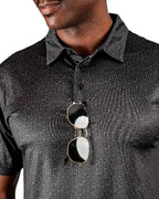 Men’s Man’s Best Friend Dark golf polo by Pins & Aces featuring a subtle dog-inspired pattern on a dark charcoal performance polo with short sleeves and athletic fit.