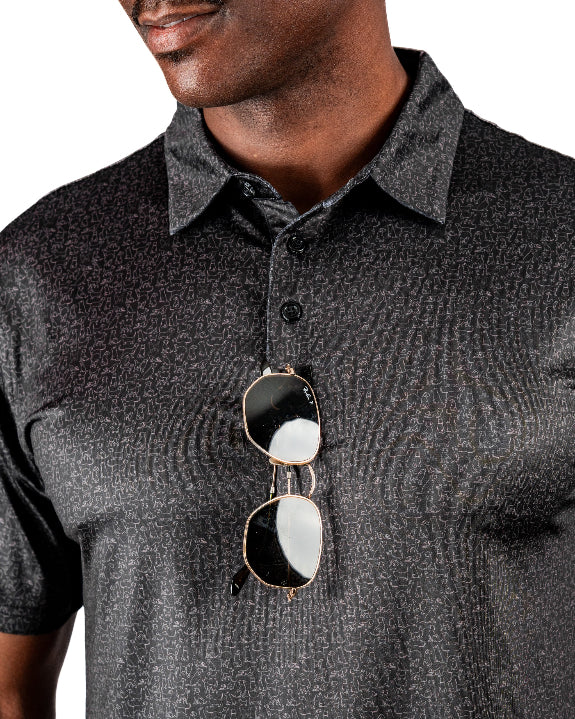 Men’s Man’s Best Friend Dark golf polo by Pins & Aces featuring a subtle dog-inspired pattern on a dark charcoal performance polo with short sleeves and athletic fit.
