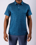 Men’s Manta Ray golf polo by Pins & Aces featuring a deep ocean blue all-over aquatic-inspired pattern, short sleeves, collared neckline, and athletic performance fit.