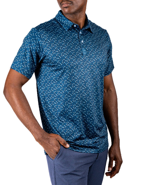 Men’s Manta Ray golf polo by Pins & Aces featuring a deep ocean blue all-over aquatic-inspired pattern, short sleeves, collared neckline, and athletic performance fit.