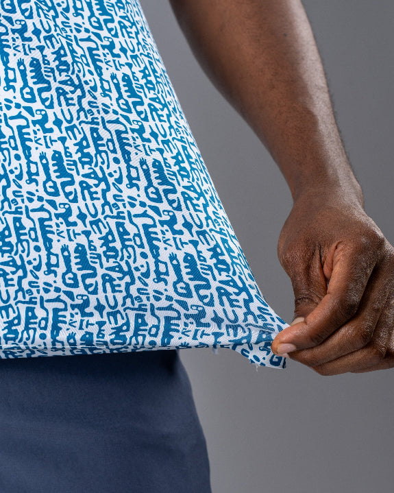 Men’s Maze Craze golf polo by Pins & Aces featuring an all-over blue maze-inspired geometric pattern with short sleeves and an athletic performance fit.