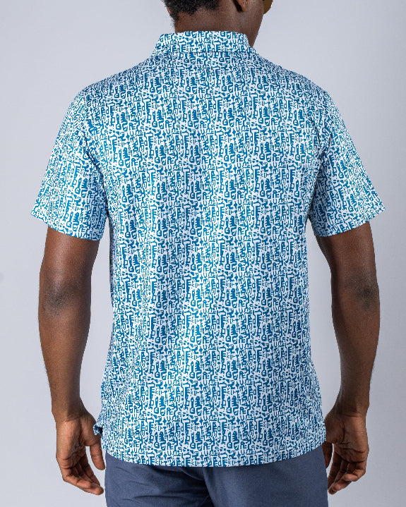Men’s Maze Craze golf polo by Pins & Aces featuring an all-over blue maze-inspired geometric pattern with short sleeves and an athletic performance fit.